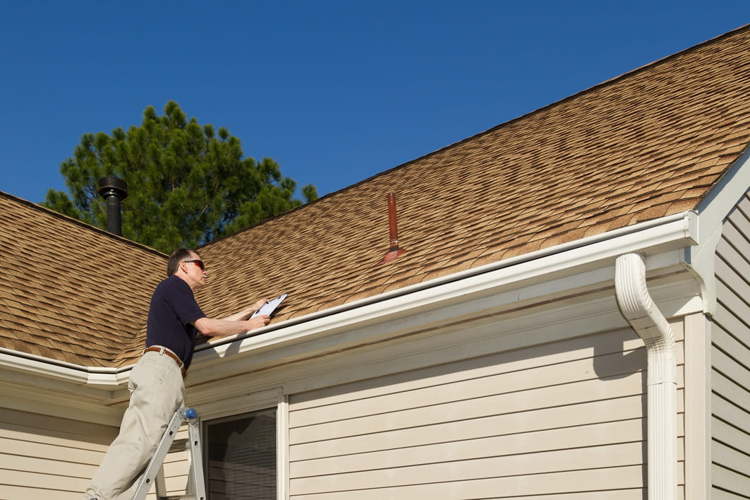 Home Inspector Examining Roof